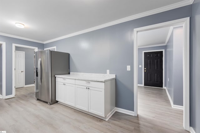 kitchen featuring stainless steel fridge with ice dispenser, white cabinets, ornamental molding, light stone counters, and light hardwood / wood-style floors