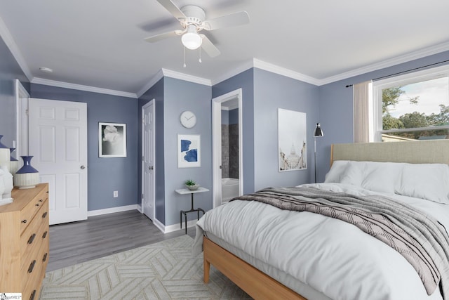 bedroom with dark wood-type flooring, ceiling fan, ornamental molding, and ensuite bath