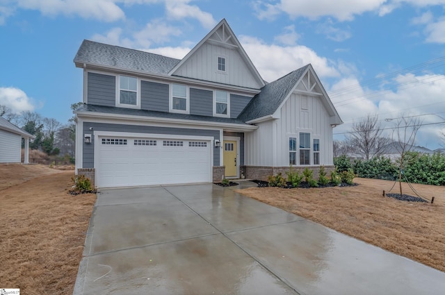 view of front of property with a garage and a front lawn