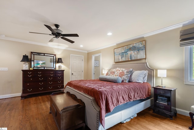 bedroom featuring crown molding, hardwood / wood-style floors, and ceiling fan