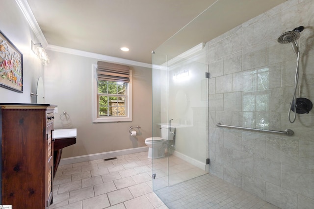 bathroom featuring toilet, an enclosed shower, ornamental molding, vanity, and tile patterned flooring