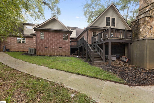 back of house featuring a yard, a deck, and central air condition unit