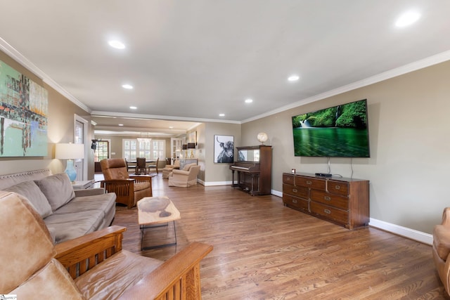 living room featuring crown molding and hardwood / wood-style flooring