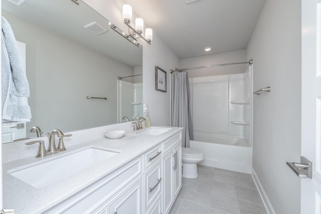 full bathroom with vanity, tile patterned floors, toilet, and shower / bath combo with shower curtain