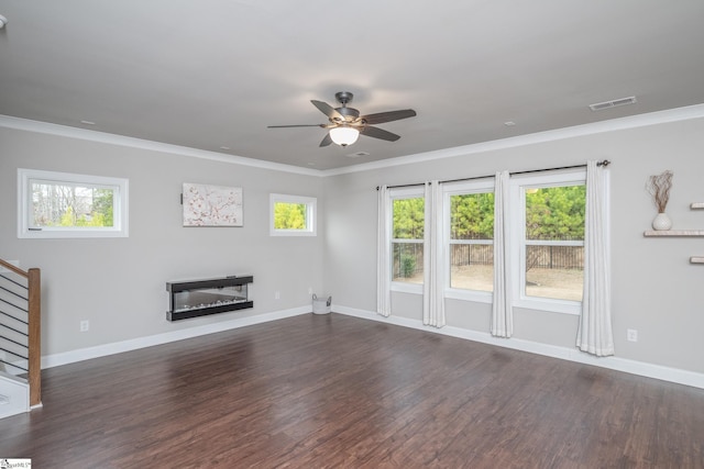 unfurnished living room featuring dark wood-type flooring, ceiling fan, and ornamental molding