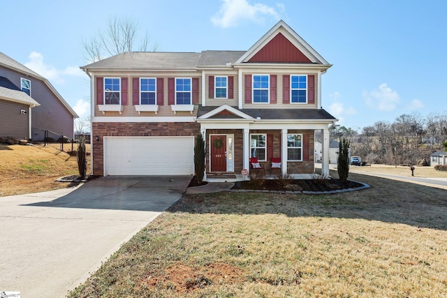 view of front of home with a garage, covered porch, and a front yard