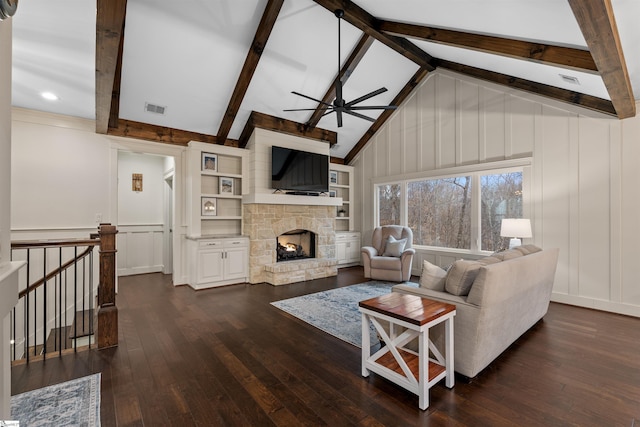 living room with a stone fireplace, high vaulted ceiling, dark hardwood / wood-style floors, beamed ceiling, and ceiling fan