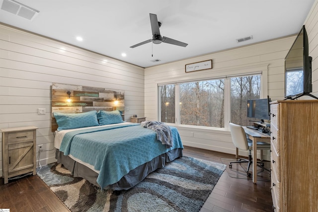 bedroom featuring ceiling fan and dark hardwood / wood-style floors