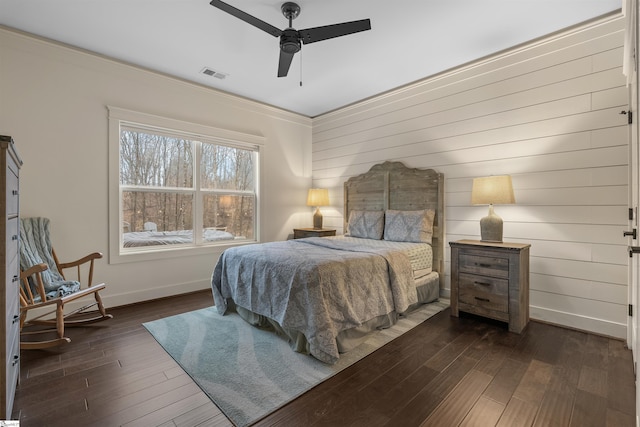 bedroom featuring dark wood-type flooring and ceiling fan