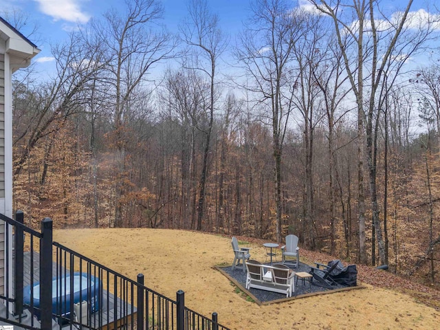 view of yard with a fire pit