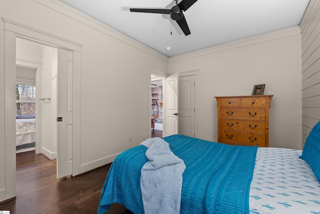 bedroom featuring ceiling fan, ornamental molding, and dark hardwood / wood-style flooring