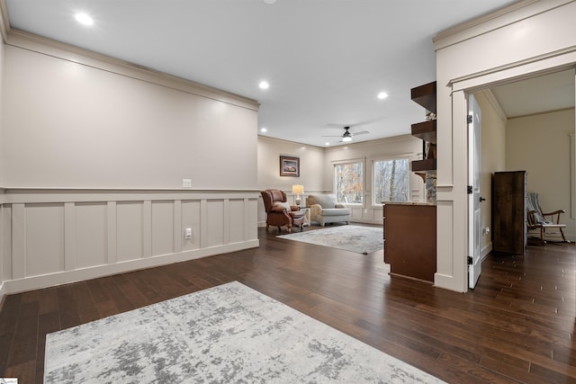 interior space with crown molding, dark wood-type flooring, and ceiling fan