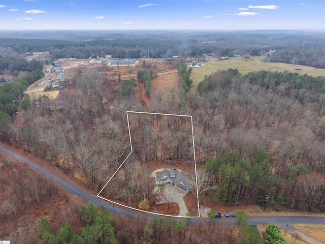 birds eye view of property with a rural view