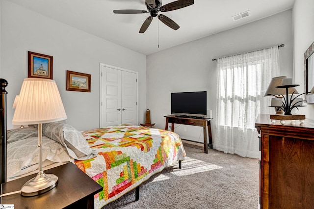 bedroom with carpet floors, a closet, and ceiling fan