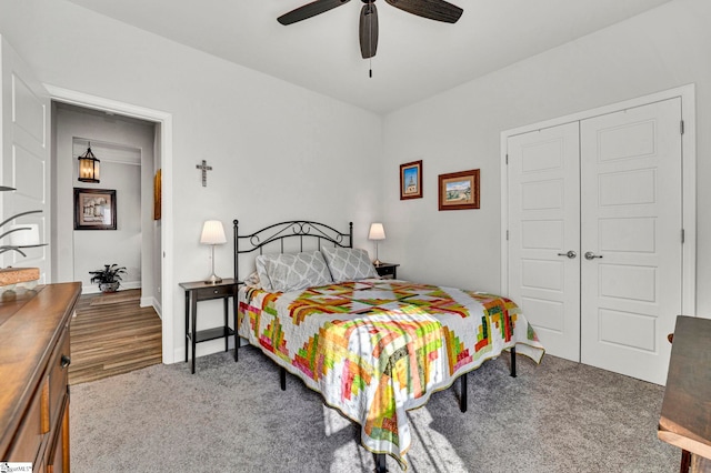 bedroom with a closet, ceiling fan, and carpet