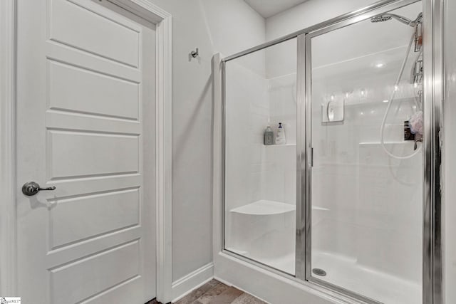 bathroom with a shower with shower door