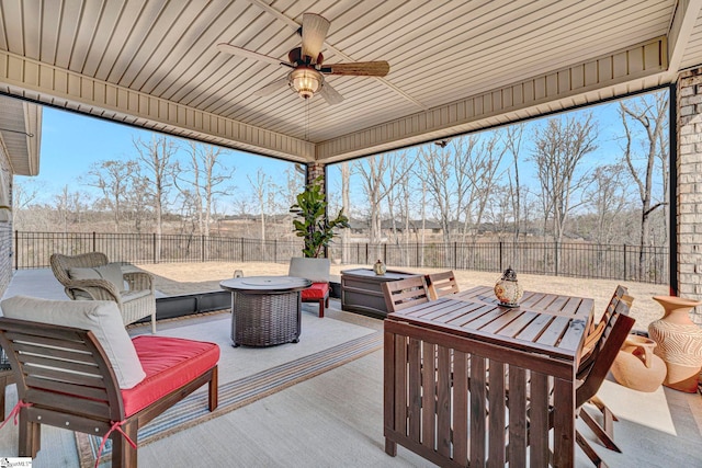 view of patio / terrace featuring an outdoor living space with a fire pit and ceiling fan