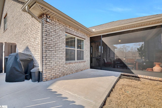 entrance to property featuring a patio