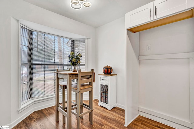 dining area with hardwood / wood-style flooring