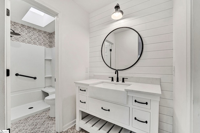 bathroom featuring a shower, wooden walls, and toilet