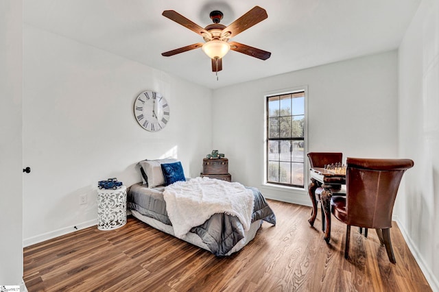 bedroom with ceiling fan and hardwood / wood-style floors