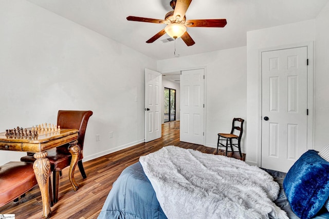 bedroom featuring hardwood / wood-style flooring and ceiling fan