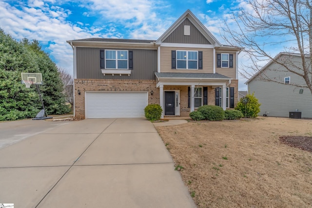 view of front of home featuring a garage, covered porch, and a front lawn