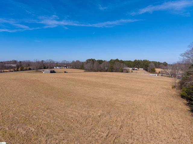 exterior space with a rural view