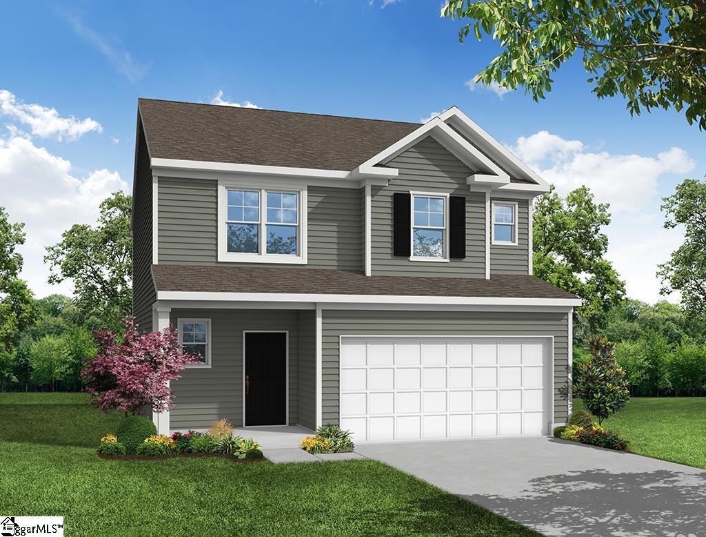 view of front of home with a garage and a front yard