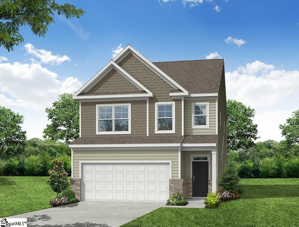 craftsman house with a garage and a front lawn