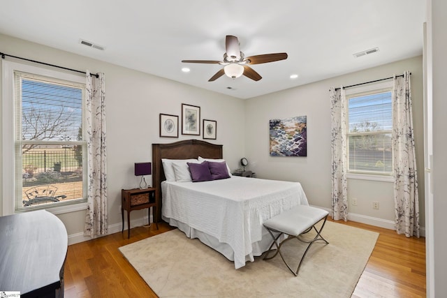 bedroom with hardwood / wood-style flooring and ceiling fan