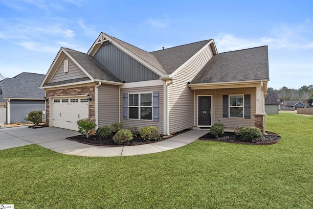 craftsman house with a garage and a front lawn