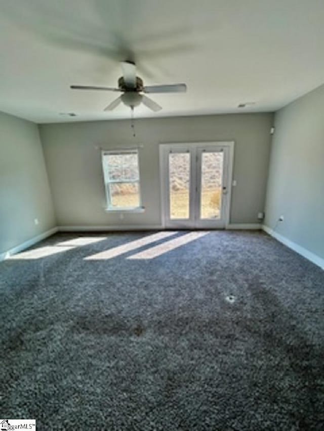 empty room featuring carpet flooring and ceiling fan