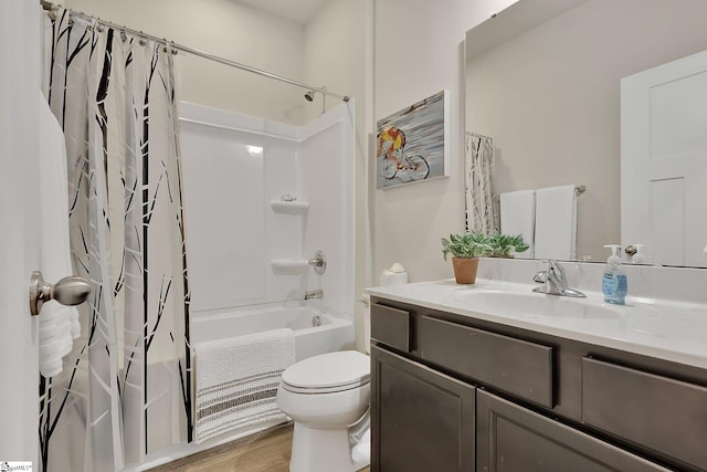 full bathroom featuring shower / tub combo with curtain, vanity, hardwood / wood-style floors, and toilet