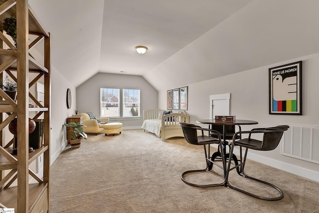 carpeted bedroom with vaulted ceiling