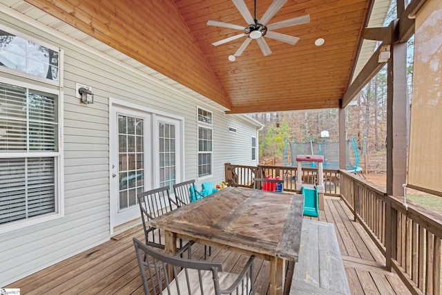 wooden deck featuring a trampoline and ceiling fan