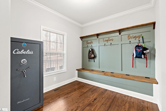 mudroom featuring ornamental molding and dark wood-type flooring