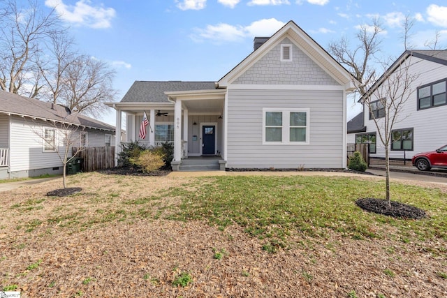 view of front facade with a front lawn and covered porch