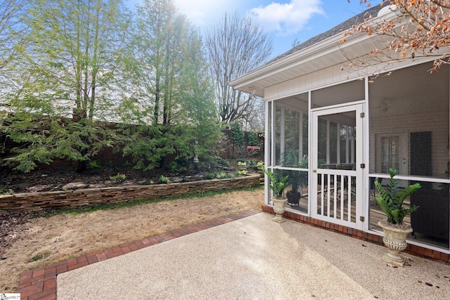 view of patio / terrace with a sunroom