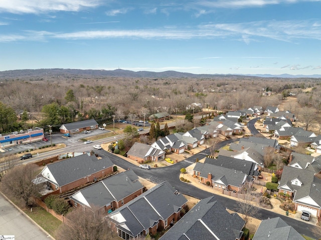 birds eye view of property with a mountain view