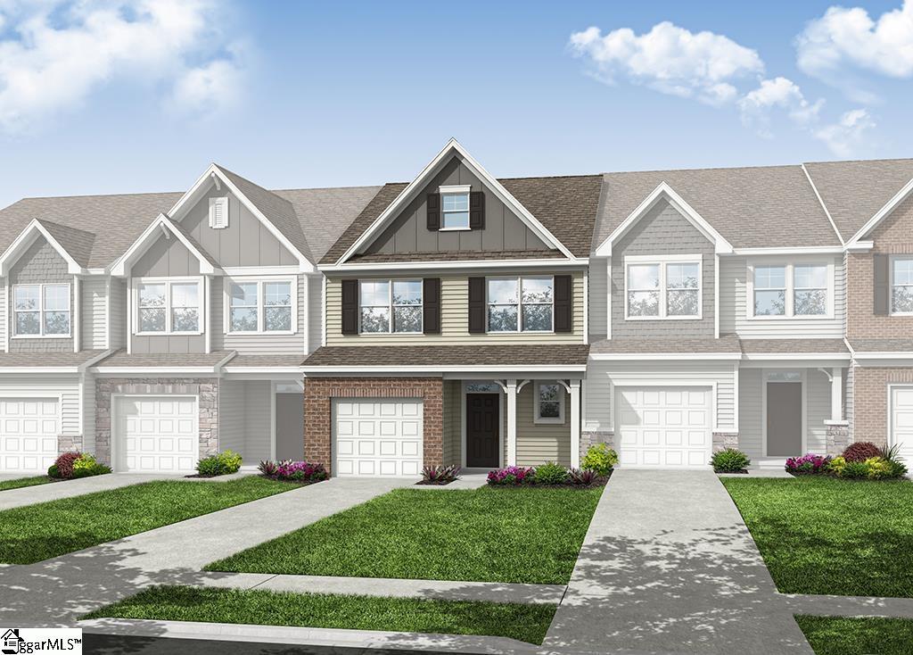 multi unit property with board and batten siding, a front lawn, and a garage