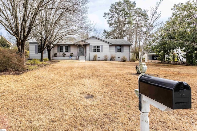 ranch-style house with a front lawn