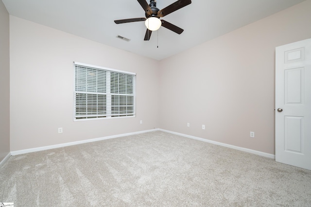 carpeted empty room with ceiling fan