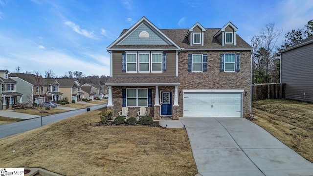 view of front facade featuring a garage and covered porch