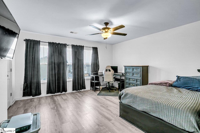 bedroom featuring light hardwood / wood-style flooring and ceiling fan