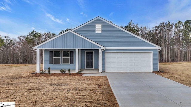 view of front of house featuring a garage and a front yard