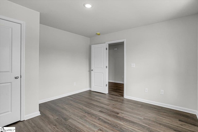 empty room featuring dark hardwood / wood-style floors