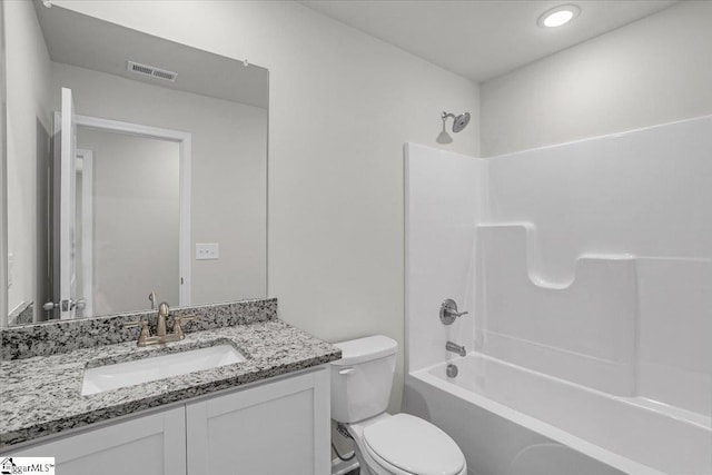 full bathroom with shower / tub combination, vanity, and toilet