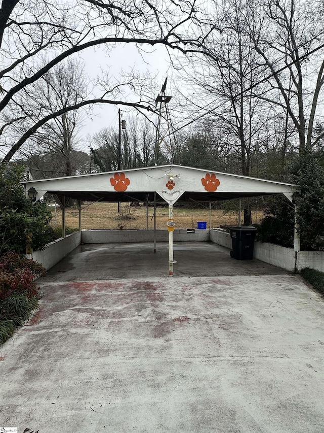 view of vehicle parking with a carport