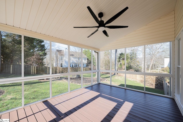 unfurnished sunroom with lofted ceiling and ceiling fan